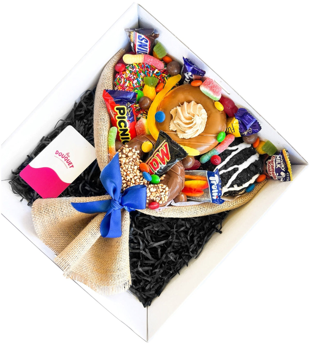 Angled view of our Small Men's Deluxe Donut Bouquet filled with donuts, chocolates and lollies, a unique gift for him in Perth.