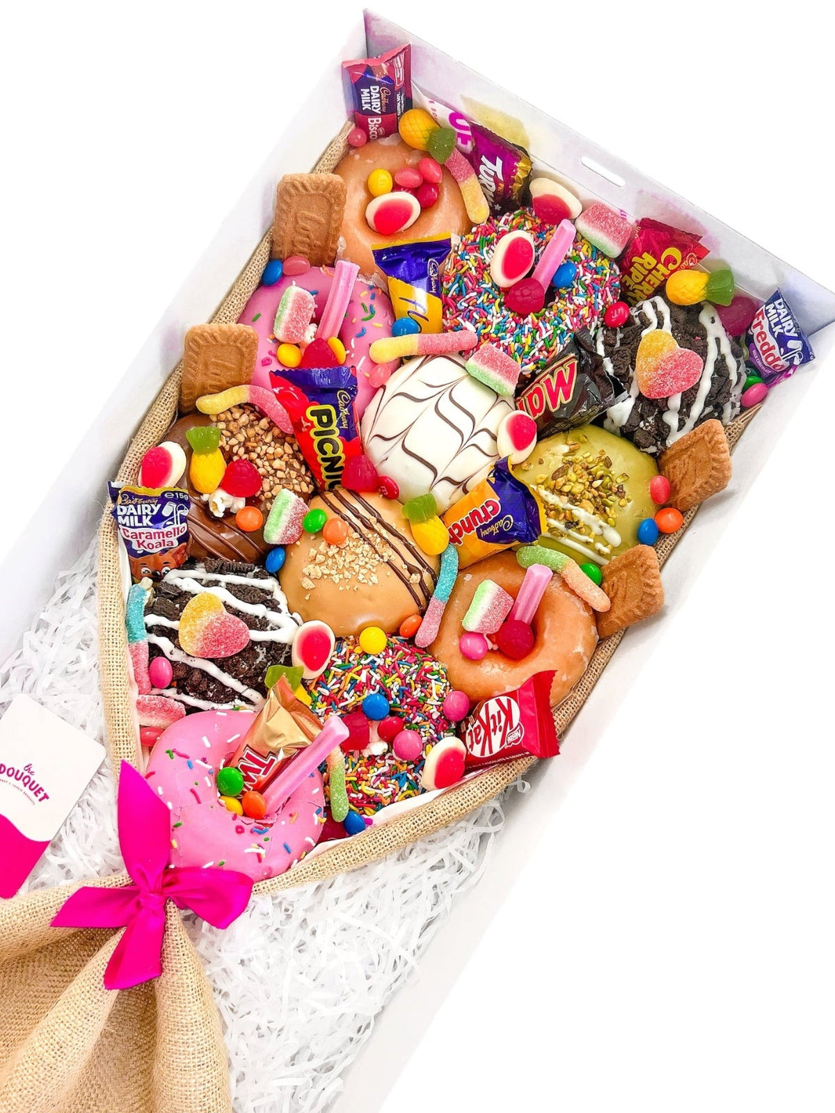 Angled view of a Large Mixed Deluxe Donut Bouquet featuring assorted donuts and colourful sweets.