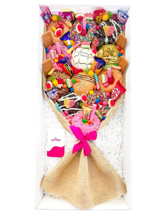 Large Mixed Deluxe Donut Bouquet filled with colourful donuts and lollies, with a pink ribbon.