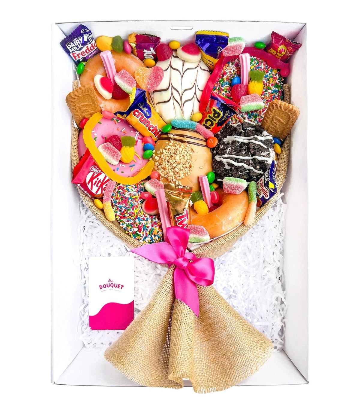 Medium Mixed Deluxe Donut Bouquet featuring assorted donuts and colourful lollies, wrapped with a pink ribbon.