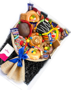 Angled view of our Medium Men's Deluxe Donut Bouquet packed with sweet treats, chocolates and lollies, available for delivery across Perth.