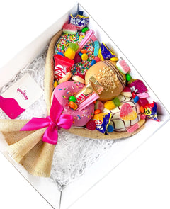Angled view of a Small Mixed Deluxe Donut Bouquet with assorted donuts and colourful sweets.